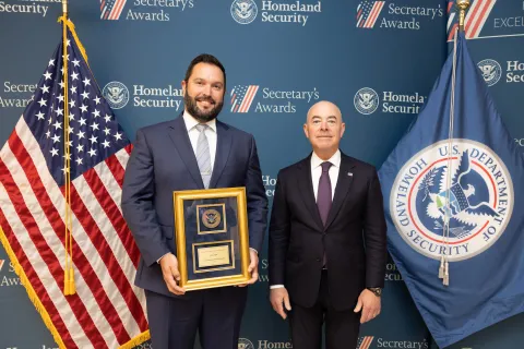 Leadership Excellence Award recipient Scott Eads with DHS Secretary Alejandro Mayorkas.