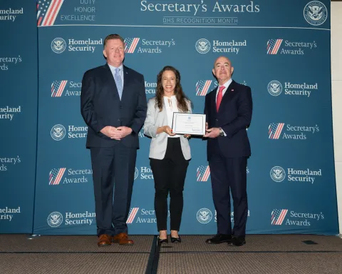Left to right: U.S. Secret Service Director James Murray, Innovation Award recipient Ashley Blair and DHS Secretary Alejandro Mayorkas.