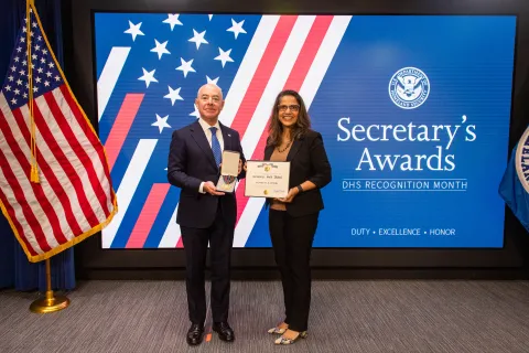 DHS Secretary Alejandro Mayorkas and Secretary's Gold Medal recipient Sangeeta Kaushik.