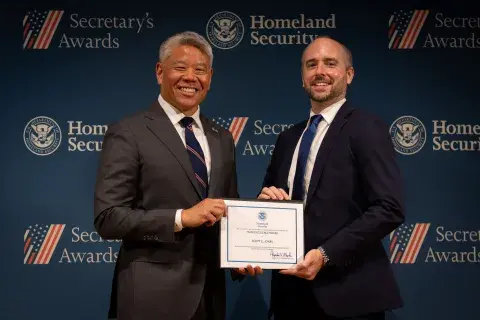 DHS Deputy Secretary John Tien with Team Excellence Award recipient, Scott E. Jones.