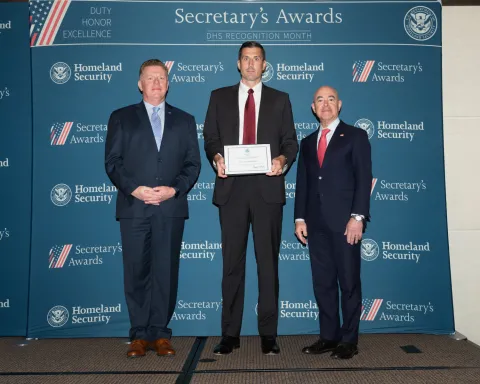 Left to right: U.S. Secret Service Director James Murray, Team Excellence Award recipient Matthew DeMasters, and DHS Secretary Alejandro Mayorkas.