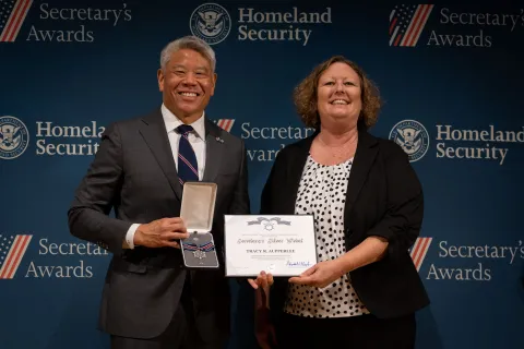 DHS Deputy Secretary John Tien with Secretary's Silver Medal recipient, Tracy R. Aupperlee.