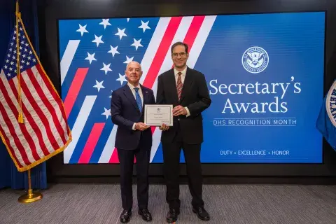 DHS Secretary Alejandro Mayorkas with Innovation Award recipient, Michael Dalton.