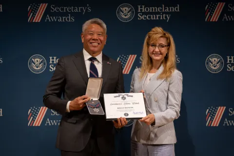DHS Deputy Secretary John Tien with Secretary's Silver Medal recipient, Kelly Hanlon.