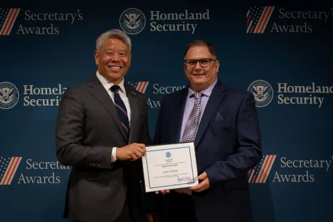 DHS Deputy Secretary John Tien with Innovation Award recipient, Scott Clifford.