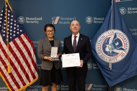 Silver Medal Award recipient Dung B. On and DHS Secretary Alejandro Mayorkas.