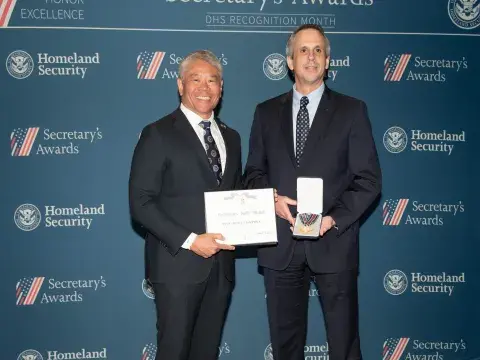 DHS Deputy Secretary John Tien and Secretary's Gold Medal recipient Manfred F. Harpole.