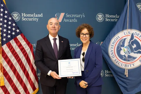 DHS Secretary Alejandro Mayorkas with Innovation Award recipient, Julia D. Peterson.