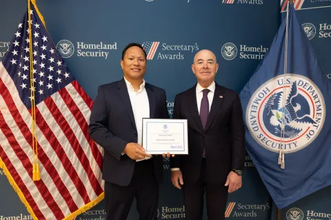 Innovation Award recipient Ronie Brian M. Namata with DHS Secretary Alejandro Mayorkas.