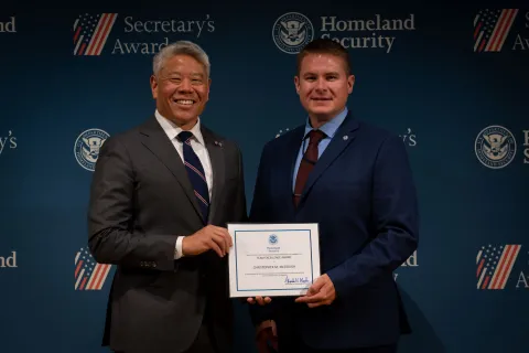 DHS Deputy Secretary John Tien with Team Excellence Award recipient, Christopher M. McGough.