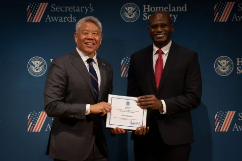 DHS Deputy Secretary John Tien with Team Excellence Award recipient, Todd Woodard.