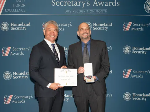 DHS Deputy Secretary John Tien and Secretary's Gold Medal recipient Michael L. Vesta.