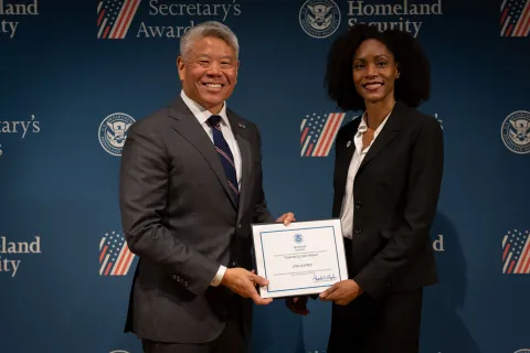 DHS Deputy Secretary John Tien with Team Excellence Award recipient, Lynn Dupree.