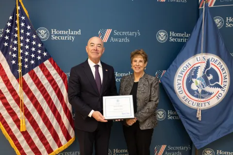 DHS Secretary Alejandro Mayorkas with Innovation Award recipient Phyllis A. Coven.