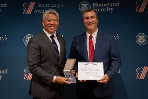 DHS Deputy Secretary John Tien with Secretary's Silver Medal recipient, Steven W. Maynard.