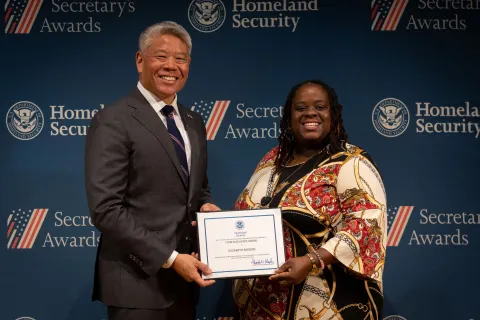 DHS Deputy Secretary John Tien with Team Excellence Award recipient, Elizabeth Banson.