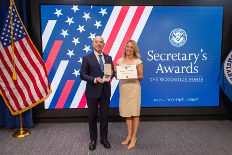 DHS Secretary Alejandro Mayorkas and Secretary's Gold Medal recipient Marian Manlove.