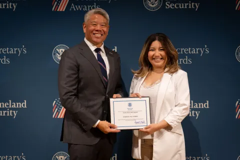 DHS Deputy Secretary John Tien with Team Excellence Award recipient, Jennifer Vigil Torres.
