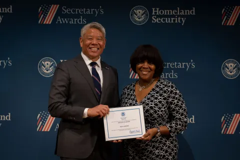 DHS Deputy Secretary John Tien with Innovation Award recipient, Nica Mathes.
