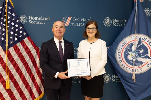 DHS Secretary Alejandro Mayorkas with Innovation Award recipient, Lea-Ann B. Bigelow.