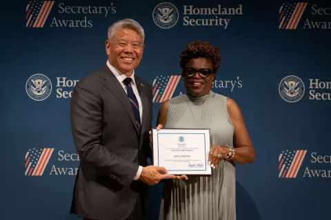 DHS Deputy Secretary John Tien with Team Excellence Award recipient, Anita Anderson.