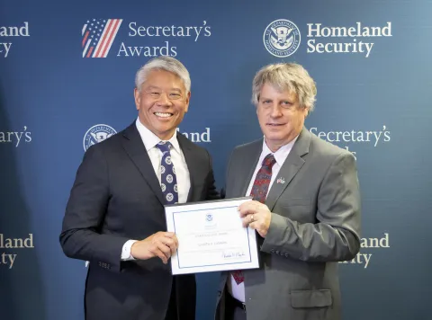 DHS Deputy Secretary John Tien with Team Excellence Award recipient, Gareth R. Canaan.