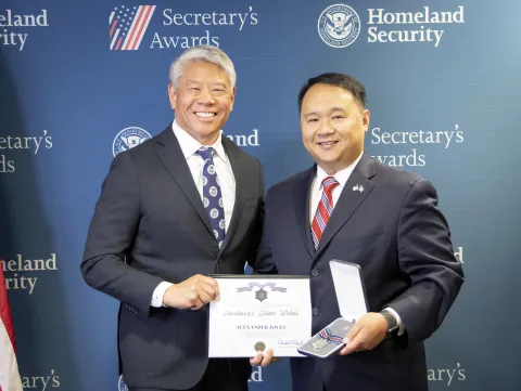 DHS Deputy Secretary John Tien with Secretary's Silver Medal recipient, Alexander Joves.