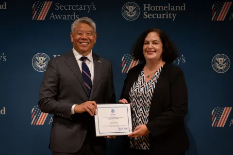 DHS Deputy Secretary John Tien with Innovation Award recipient, Eden Miller.