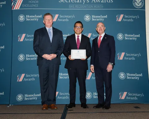 Left to right: U.S. Secret Service Director James Murray, Team Excellence Award recipient Roland deDios, and DHS Secretary Alejandro Mayorkas.