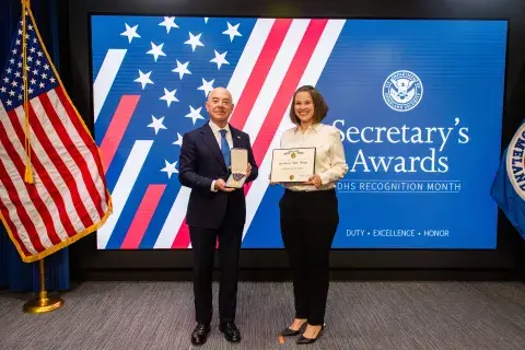 DHS Secretary Alejandro Mayorkas and Secretary's Gold Medal recipient Danielle Sharifi.
