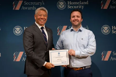 DHS Deputy Secretary John Tien with Team Excellence Award recipient, Henry Rand.