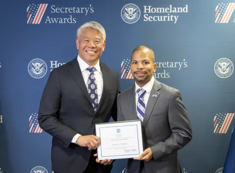 DHS Deputy Secretary John Tien with Team Excellence Award recipient, Michael J. Thomas.