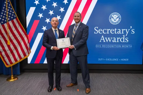 DHS Secretary Alejandro Mayorkas with Innovation Award recipient, Elijah I. Brigham.