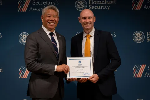 DHS Deputy Secretary John Tien with Leadership Excellence Award recipient, Adam Hunter.