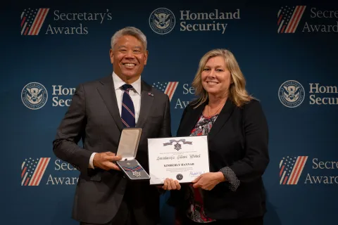 DHS Deputy Secretary John Tien with Secretary's Silver Medal recipient, Kimberly Hannah.