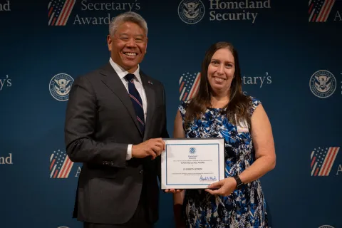DHS Deputy Secretary John Tien with Team Excellence Award recipient, Elizabeth Koren.