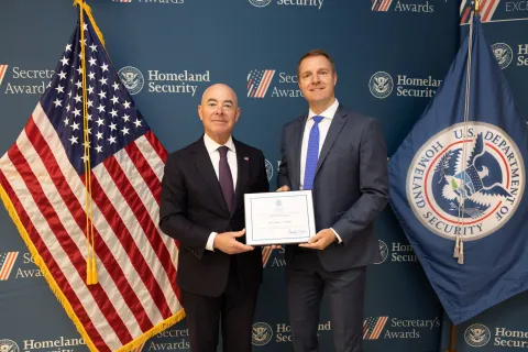 DHS Secretary Alejandro Mayorkas with Innovation Award recipient Nathaniel I. Stiefel.