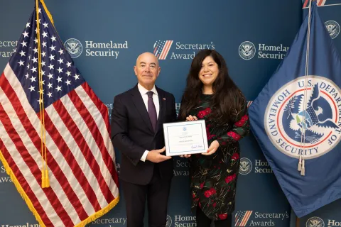 DHS Secretary Alejandro Mayorkas with Innovation Award recipient Jessica Membreno.