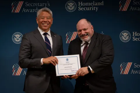 DHS Deputy Secretary John Tien with Team Excellence Award recipient, Mark Menacker.