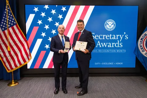 DHS Secretary Alejandro Mayorkas and Secretary's Gold Medal recipient Ronald Schuster.