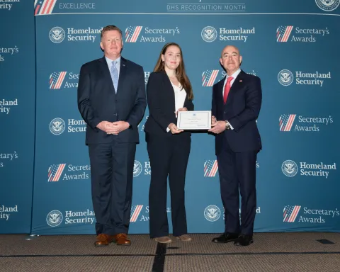 Left to right: U.S. Secret Service Director James Murray, Team Excellence Award recipient Anna Czech, and DHS Secretary Alejandro Mayorkas.