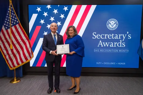 DHS Secretary Alejandro Mayorkas with Innovation Award recipient, Lorraine C. Castillo.