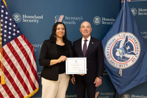 Innovation Award recipient Sheena G. Holman with DHS Secretary Alejandro Mayorkas.