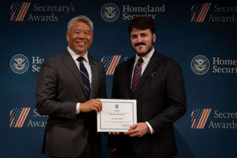 DHS Deputy Secretary John Tien with Team Excellence Award recipient, William Cooper.