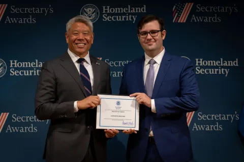 DHS Deputy Secretary John Tien with Innovation Award recipient, Cameron Brigham.