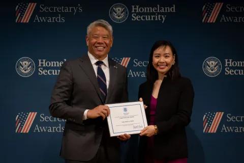 DHS Deputy Secretary John Tien with Team Excellence Award recipient, Thai-Binh H. Tran.