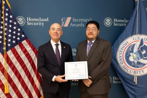 DHS Secretary Alejandro Mayorkas with Innovation Award recipient, Adam L. Malinowski.