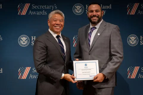 DHS Deputy Secretary John Tien with Team Excellence Award recipient, Eric Neuschaefer.