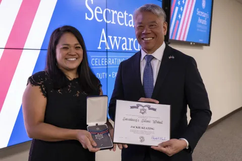Secretary's Silver Medal recipient, Jackie Keating, with DHS Deputy Secretary John Tien.