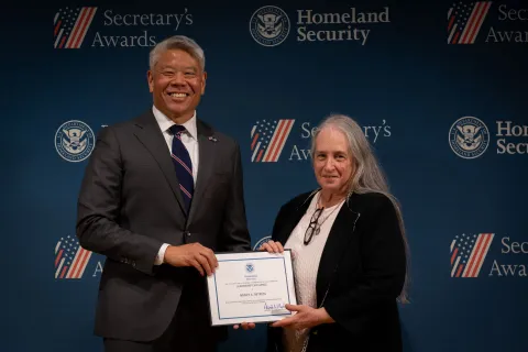 DHS Deputy Secretary John Tien with Leadership Excellence Award recipient, Nancy A. Betress.